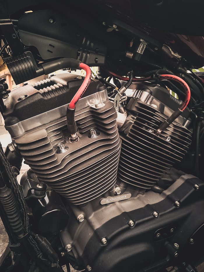 Detailed view of a motorcycle engine showcasing intricate mechanical parts and design.